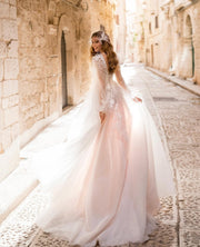 Feather-detailed A-line gown with plunging V-neckline and long sleeves - Amelie Baku Couture
