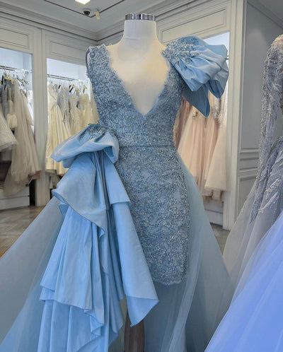 Ball Gown with ruffles and pleated skirt.