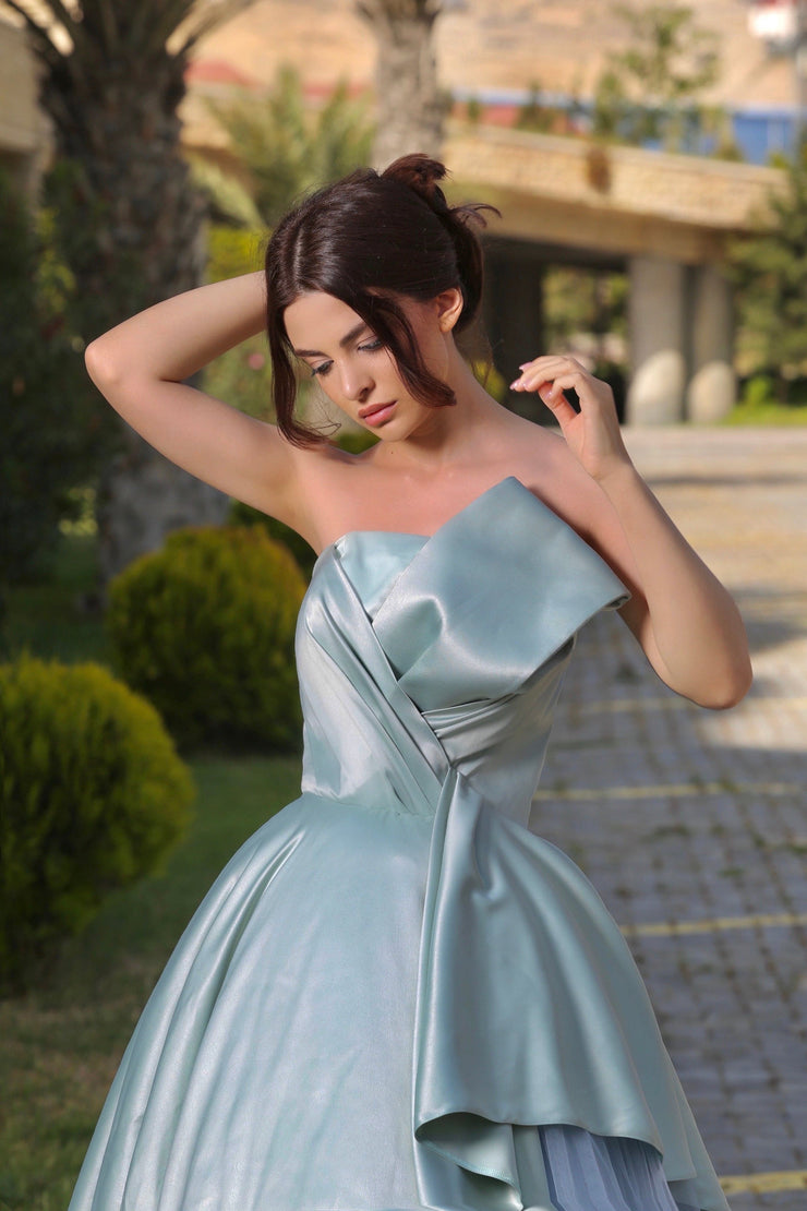 Blue A-line gown with bow accent on the bust - Amelie Baku Couture