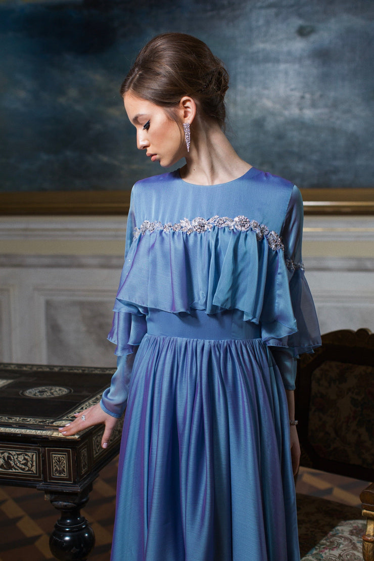 Chiffon dress with crew neckline and long sleeves.